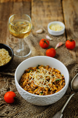 Minced meat tomato orzo with shredded cheese and fresh tomatoes and garlic slices