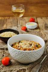 Minced meat tomato orzo with shredded cheese and fresh tomatoes and garlic slices