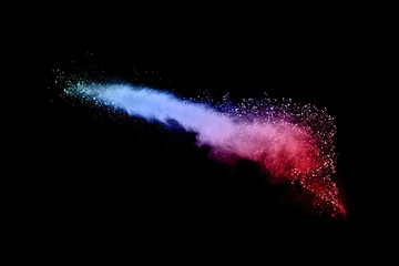 abstract colored dust explosion on a black background.abstract powder splatted background,Freeze...