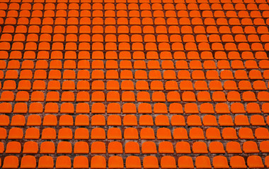 Front of the orange seats on the stadium