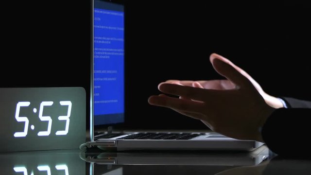 Blue screen disturbing work on laptop, infected files, cracked system, closeup