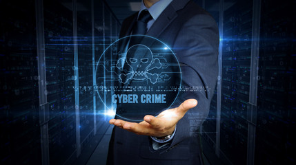 Businessman and screen with skull hologram