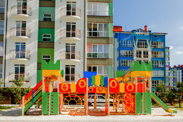 Fototapeta na wymiar New children's playground near a apartments building