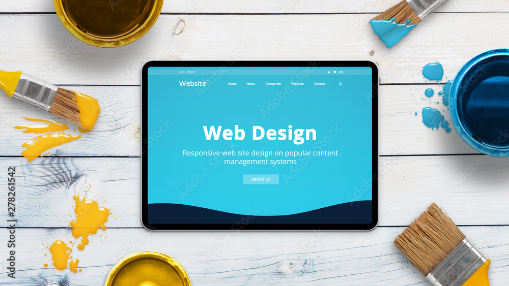 Aufkleber Web design studio web site concept on modern thin tablet surrounded by color brushes. Concept of creative painting theme layout.