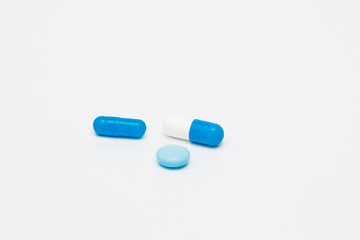 Macro view of capsule pill and tablet isolated over white background