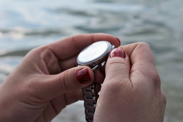 Fototapeta premium Watch in women hands.