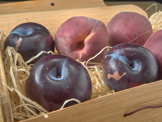Delicious juicy cherries,lying on a beautiful plate.On wood background