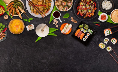 Asian food background with various ingredients on rustic stone background , top view. Vietnam and Thai cuisine.