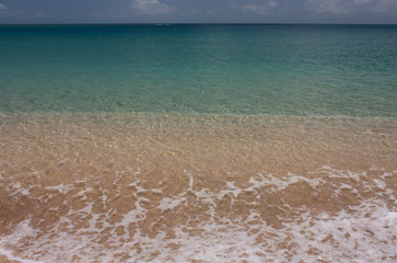 Waves and beautiful turquoise water of Tonga