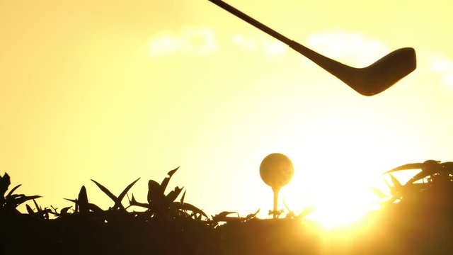 Close-up silhouette golfer hit a golf ball with a golf club footage 4K