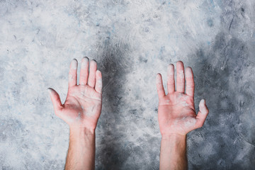 Man hands covered with paint