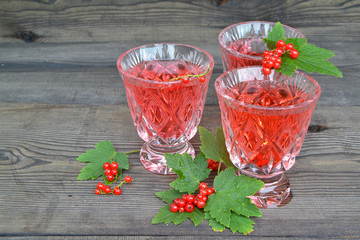 Fresh summer vitaminous beverage with balm. Compote of red currants. Summer smoothie. Summer fresh drink. With copy space
