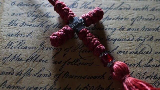 Close up of cross on manuscript