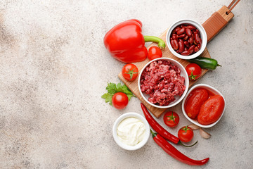 Ingredients for chili con carne on grey background