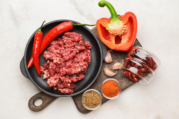 Ingredients for chili con carne on light background