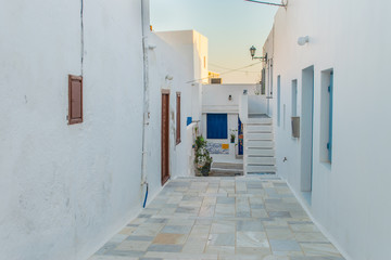Street view of Plaka village with paved alleys and traditional cycladic architecture in Milos island in Cyclades, Greece