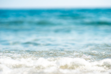 close up of a wave rolling onto the beach