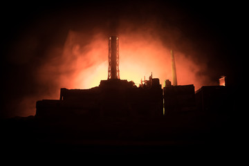 Creative artwork decoration. Chernobyl nuclear power plant at night. Layout of abandoned Chernobyl station after nuclear reactor explosion.