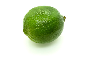 Whole ripe lime green on white background with shadow