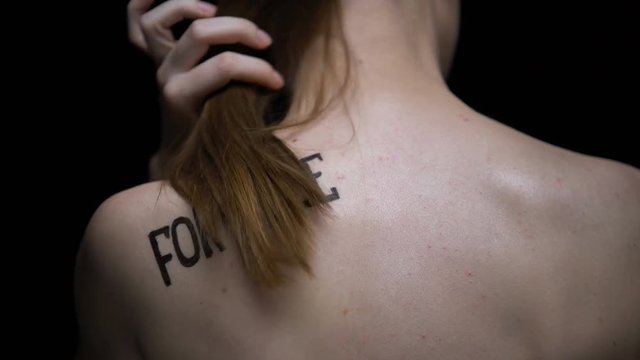 Trembling naked girl showing for sale phrase on shoulder, illegal sex industry