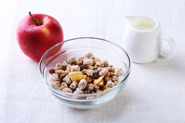 Healthy food with Corn Flakes cereal in a bowl, apple, banana and glass with milk. Morning breakfast.