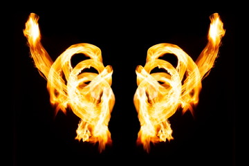 Burning fire wings on isolated black background