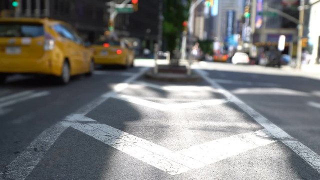 Yellow Cabs going downtown, blurred NYC avenue traffic