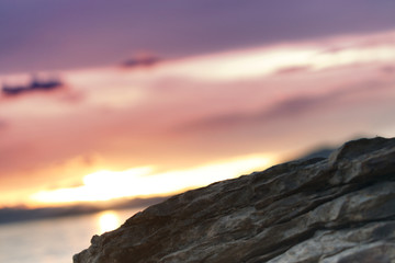 Fototapeta na wymiar Close up shot of rocks on the beach at sunset