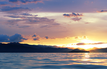 View of evening sky at sunset over the lake, Kang Krajarn National Park, Petchburi, Thailand
