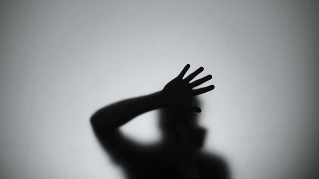 Hardly breathing silhouette trying to getting out from room, fire emergency