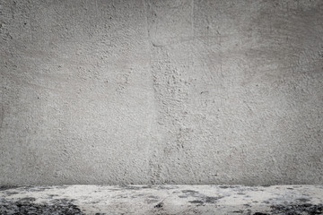 Concrete floor with empty grey concrete wall background.