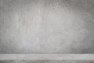 Concrete floor with empty grey concrete wall background.