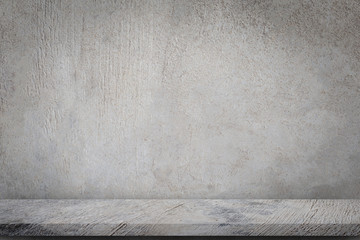 Concrete floor with empty grey concrete wall background.