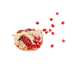 A slice of ripe pomegranate with membranes and seeds on a white background