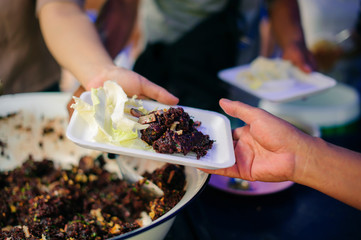 Feeding the poor to hands of a beggar : Concept of famine and social inequality : feeding food for beggar poverty concept : The society of helping to share food to the poor