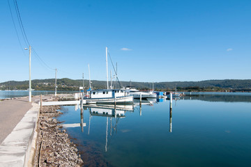 Obraz premium Waterfront maritime marina/dock with boats.