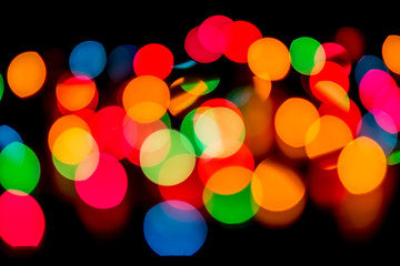 Abstract bokeh lights with black background.