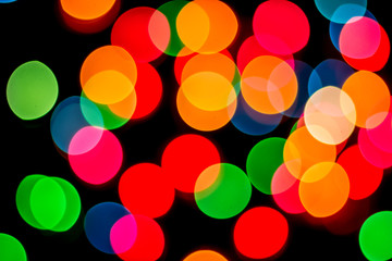 Abstract bokeh lights with black background.