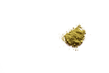 Matcha powder explosion on white background. Top view.  Japanese Culture. Popular Healthy Tea.