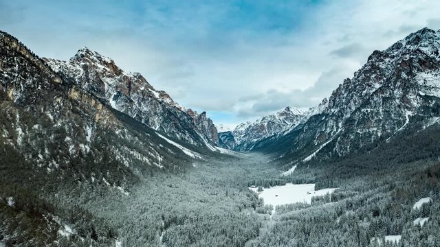 Flight over the valley to Pederu, in Fannes-Sennes natural park in South Tirol, Dolomites.