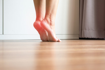 Women stretching and tiptoe foot in bedroom,Feet soles massage for plantar fasciitis,Close up
