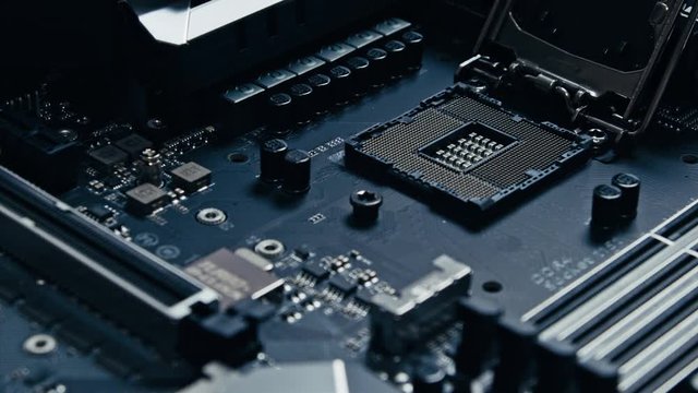 Opening the LGA socket on a motherboard and placing the CPU