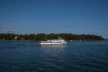 Commuting boats in the Stockholm northen archipelago a sunny summer day at the island Furusund and...