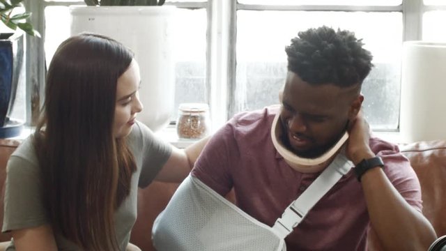 Woman Consoling An Injured Man