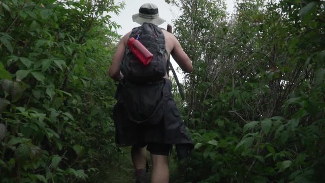 Hiker Walking Through Trail in Slow Motion