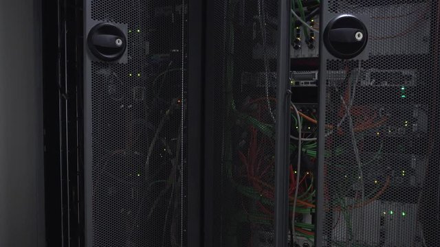 Server rack flashing led lights are in a modern data center