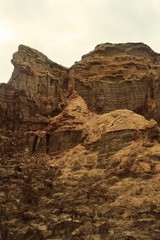 Fototapeta premium Ethiopia. The parched sea. The rocks in this photo were made of salt and at the top you can see the silt. 