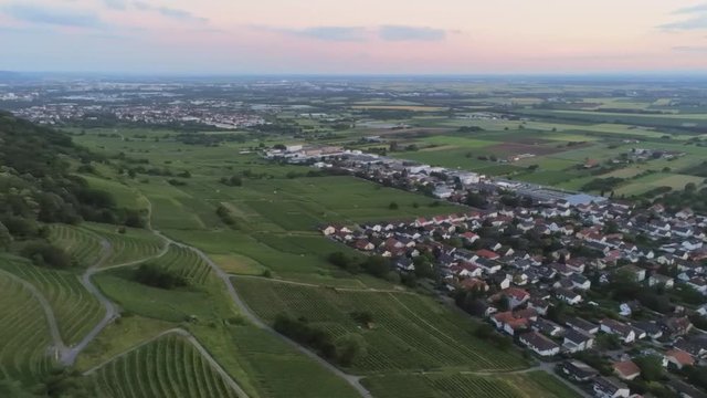 Beautiful aerial view of city in Schriesheim Germany panning over to the grape vine fields on mountain.
