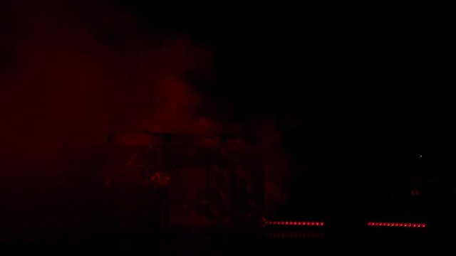 Stage light and smoke. Concert special effects. Red flashing lights.