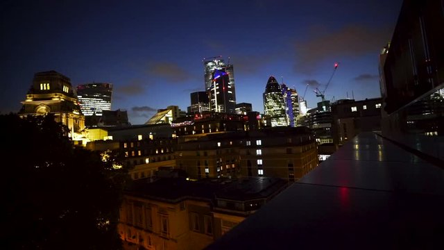 Beautiful Time laps of City Skyline in London. 30 St Mary Axe (Swiss Re Building). The City Lights up the Sky Behind it.
